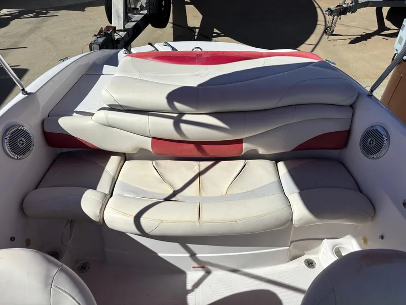 Slide: The Image of 2011 Tracker Tahoe Q5i boat interior with white and red seating. - 48