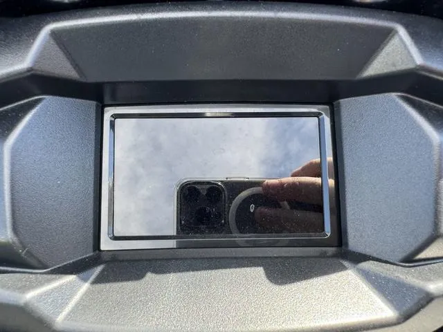 Slide: The Image of 2024 Yamaha Waverunner VX Deluxe dashboard with reflective screen and visible smartphone reflection. - 15