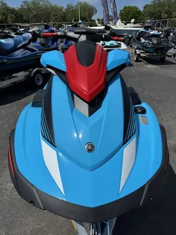 Slide: The Image of 2024 Yamaha Waverunner VX Deluxe with Audio, blue and red, displayed outdoors. - 3