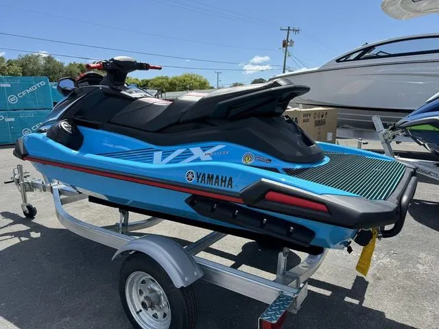 Slide: The Image of 2024 Yamaha Waverunner VX Deluxe with Audio on trailer, blue and black design. - 6