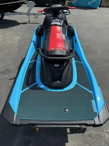 Slide: The Image of 2024 Yamaha Waverunner VX Deluxe with Audio, blue and red design, rear view. - 7