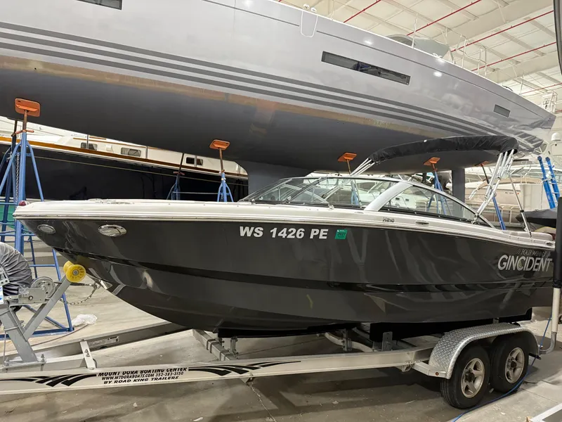 The Image of 2018 Four Winns H210 boat on trailer in indoor storage facility. - 0