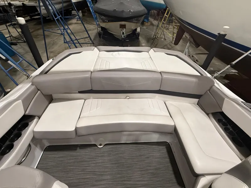 Slide: The Image of 2018 Four Winns H210 boat interior with spacious seating and cup holders. - 11