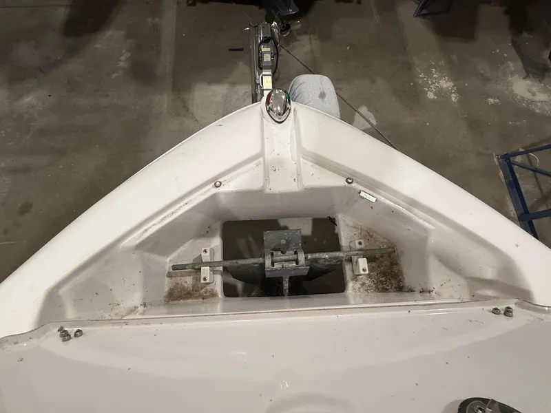 Slide: The Image of 2018 Four Winns H210 boat anchor compartment, viewed from above in a storage area. - 21