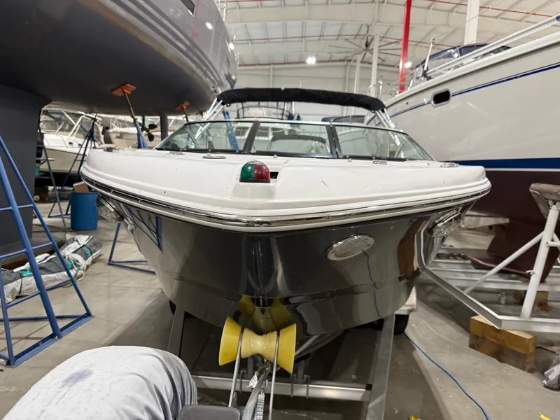 Slide: The Image of 2018 Four Winns H210 boat in a storage facility, front view. - 3