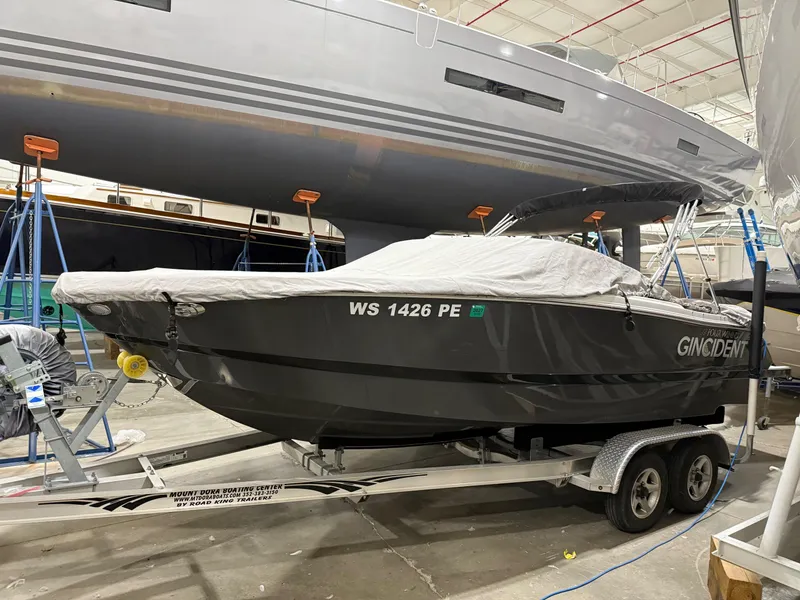 Slide: The Image of 2018 Four Winns H210 boat on trailer in storage facility. - 5