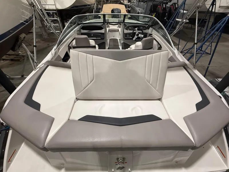 Slide: The Image of 2018 Four Winns H210 boat interior with sleek seating and modern design. - 9