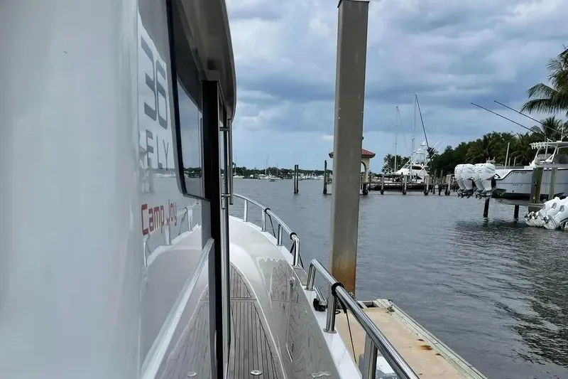 Slide: The Image of Sargo 36 Fly 2015 yacht docked at marina, cloudy sky, calm waters. - 12