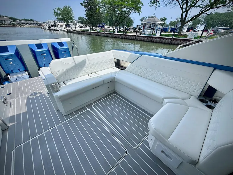 Slide: The Image of 2023 Formula 500 Super Sport Crossover boat with luxurious white seating and sleek design. - 15