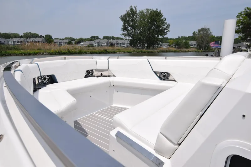 Slide: The Image of 2023 Formula 500 Super Sport Crossover boat with spacious white seating area. - 17