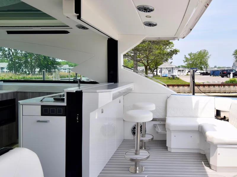 Slide: The Image of Luxurious interior of 2023 Formula 500 Super Sport Crossover yacht with modern seating and kitchenette. - 18