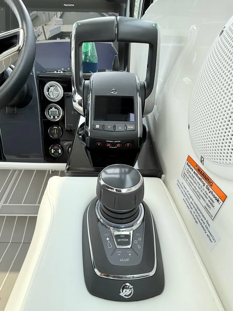Slide: The Image of 2023 Formula 500 Super Sport Crossover boat controls and dashboard. - 23