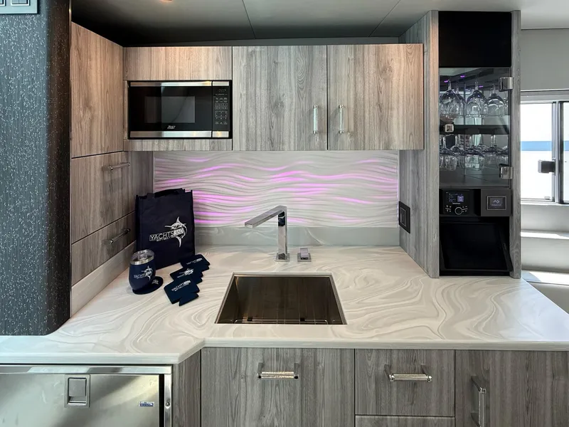 Slide: The Image of Modern kitchen in 2023 Formula 500 Super Sport Crossover yacht with sleek cabinetry and appliances. - 25