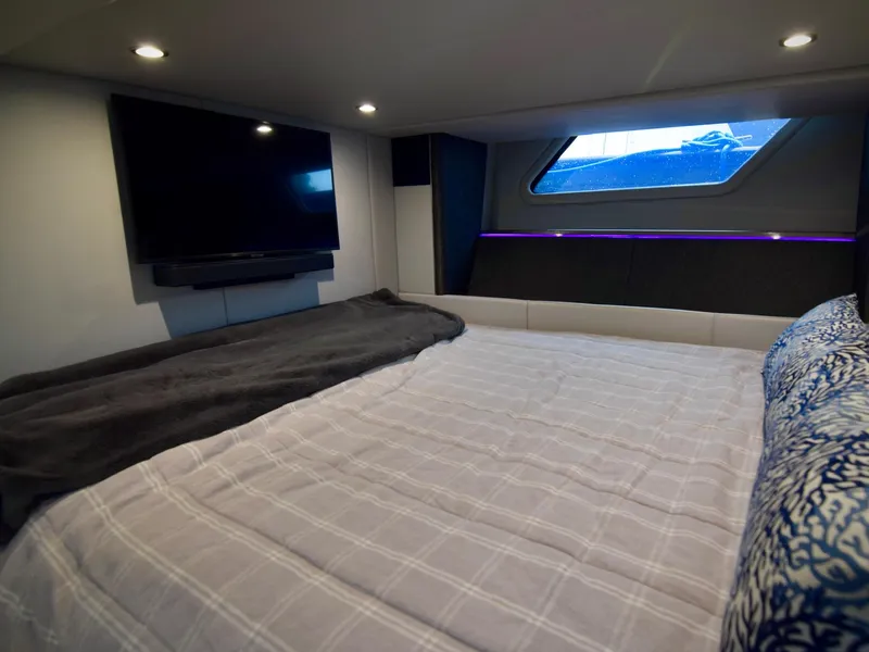 Slide: The Image of 2023 Formula 500 Super Sport Crossover cabin with bed, TV, and window view. - 29