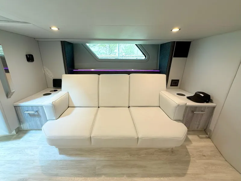 Slide: The Image of Luxurious interior of 2023 Formula 500 Super Sport Crossover with white seating and modern design. - 31