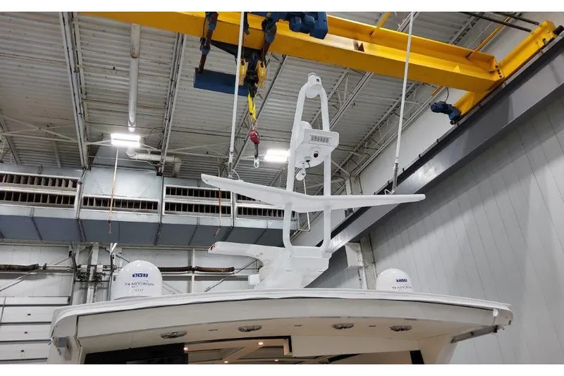 Slide: The Image of 2023 Formula 500 Super Sport Crossover yacht in a warehouse with overhead crane. - 37