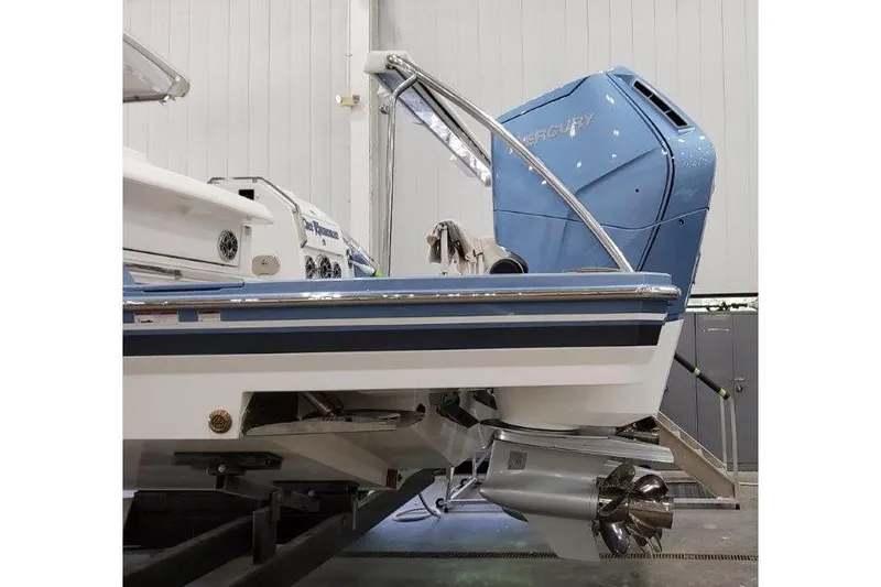 Slide: The Image of 2023 Formula 500 Super Sport Crossover boat with powerful outboard motor in a showroom. - 39