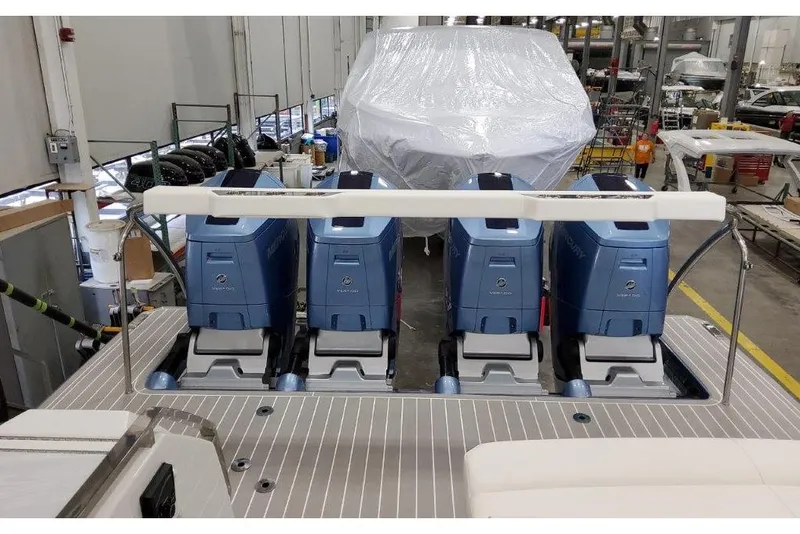 Slide: The Image of 2023 Formula 500 Super Sport Crossover with four powerful outboard engines in a workshop. - 40