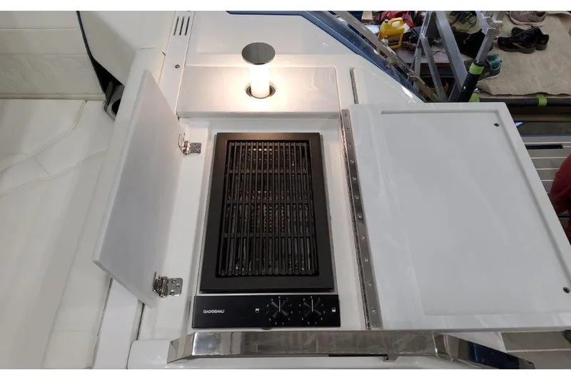 Slide: The Image of 2023 Formula 500 Super Sport Crossover boat grill with lighted cooking area. - 42