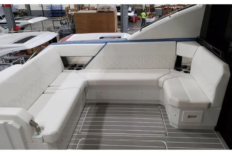 Slide: The Image of 2023 Formula 500 Super Sport Crossover boat interior with white seating and modern design. - 45