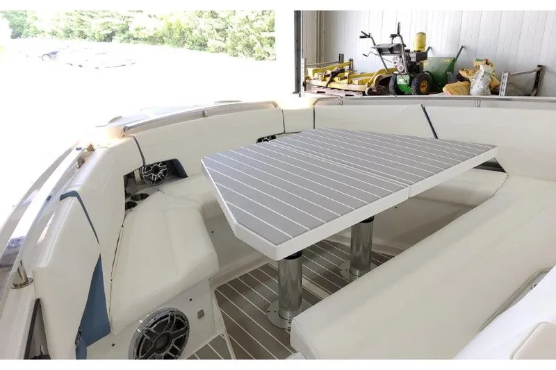 Slide: The Image of 2023 Formula 500 Super Sport Crossover boat interior with seating and table. - 52