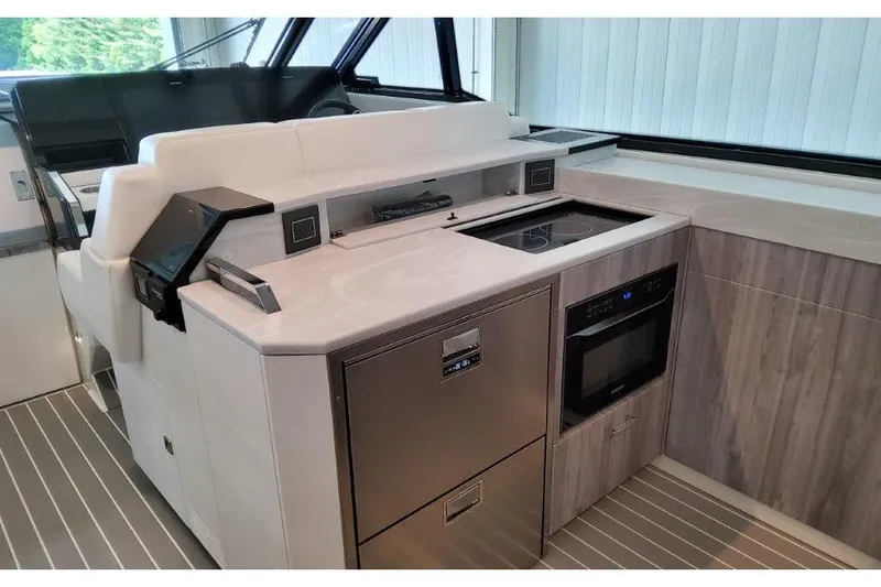 Slide: The Image of 2023 Formula 500 Super Sport Crossover yacht interior with modern kitchen amenities. - 58