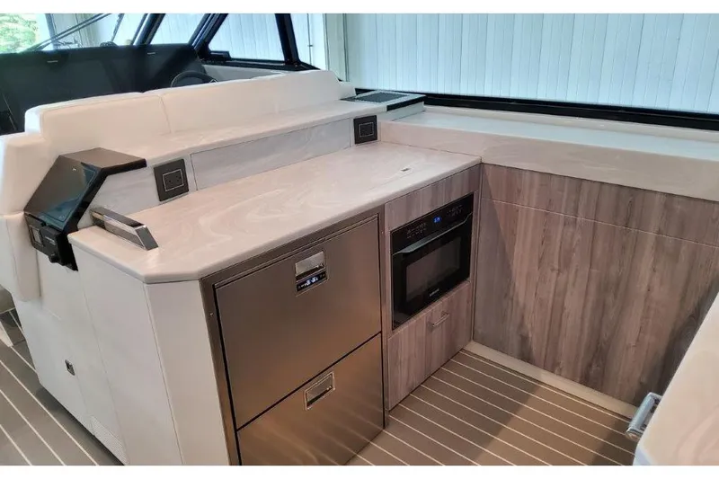 Slide: The Image of 2023 Formula 500 Super Sport Crossover interior with modern kitchen amenities. - 59