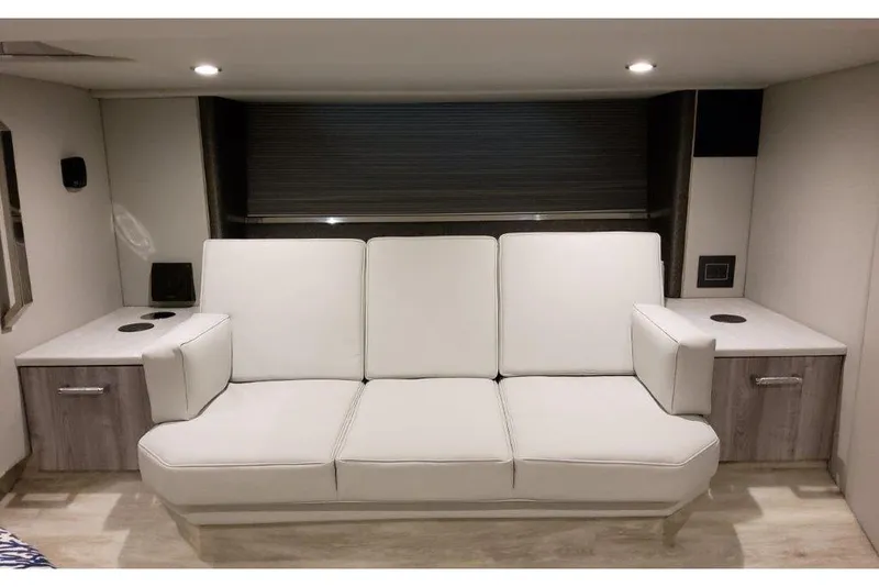 Slide: The Image of Luxurious interior of 2023 Formula 500 Super Sport Crossover with modern white sofa and cabinetry. - 68