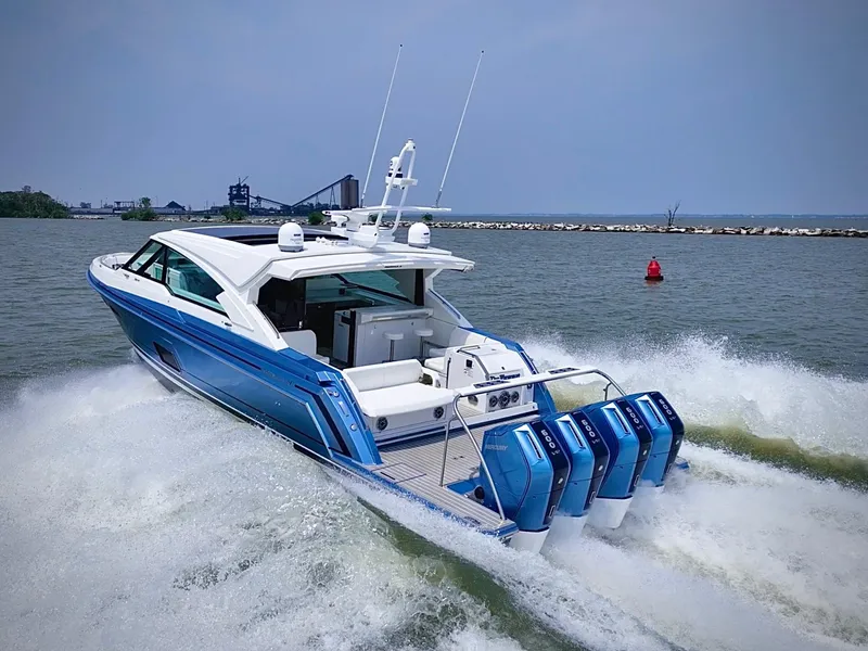 Slide: The Image of 2023 Formula 500 Super Sport Crossover boat cruising on water with powerful engines. - 7