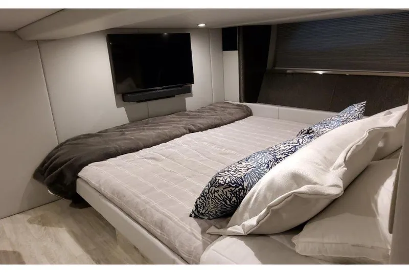Slide: The Image of Luxurious bedroom in 2023 Formula 500 Super Sport Crossover yacht with TV and plush bedding. - 70
