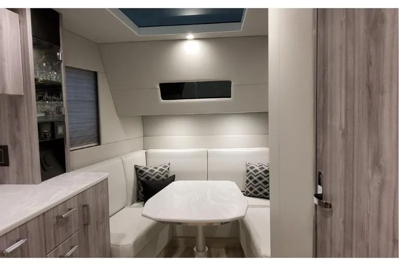 Slide: The Image of Interior of 2023 Formula 500 Super Sport Crossover with modern seating and table. - 71