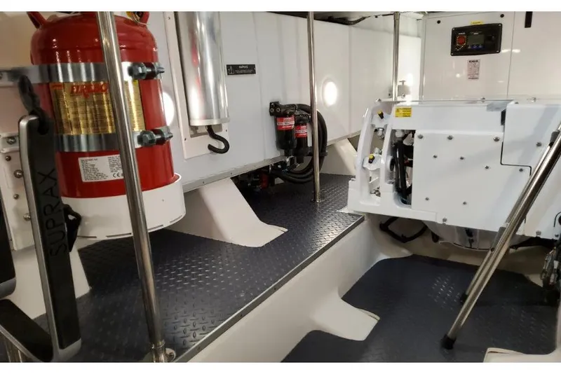 Slide: The Image of Engine room of 2023 Formula 500 Super Sport Crossover with fire extinguisher and equipment. - 81