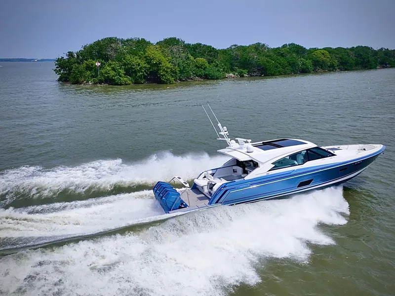 Slide: The Image of 2023 Formula 500 Super Sport Crossover cruising on a lake near a lush island. - 9