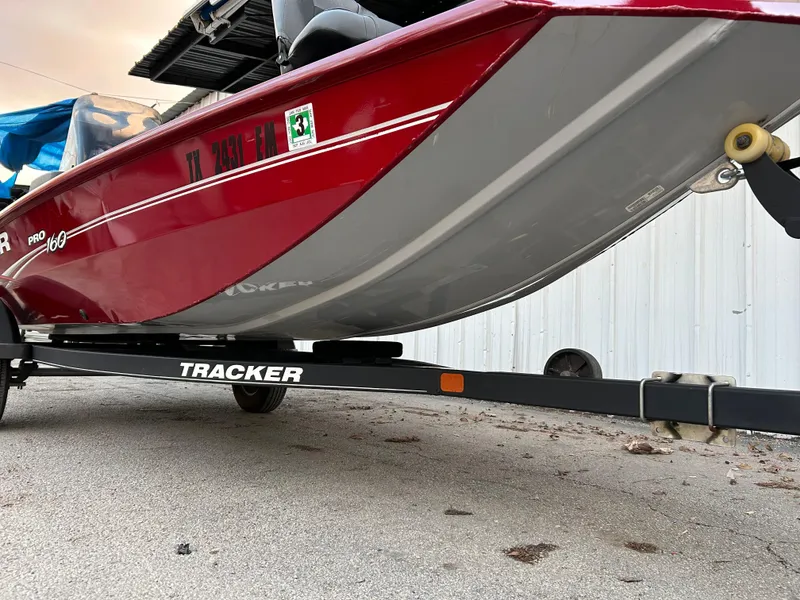 Slide: The Image of 2019 Tracker Pro 160 boat on trailer, red and gray design. - 10