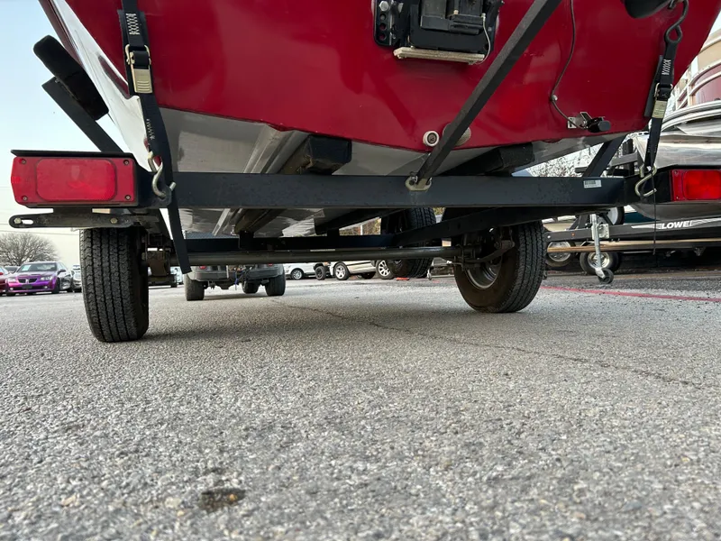 Slide: The Image of 2019 Tracker Pro 160 boat on trailer, rear view, parked on pavement. - 12