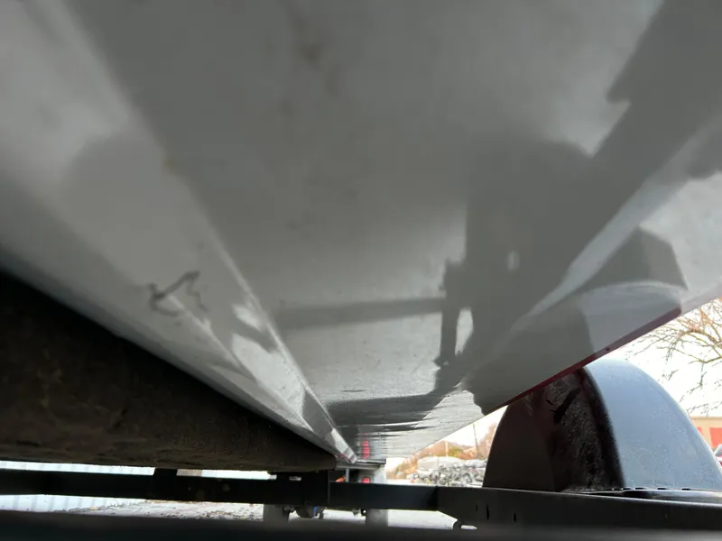 Slide: The Image of Underside view of a 2019 Tracker Pro 160 boat on a trailer. - 13