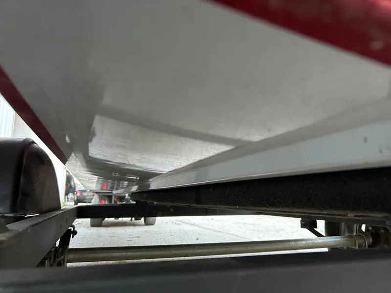 Slide: The Image of 2019 Tracker Pro 160 boat underside on trailer, close-up view. - 14