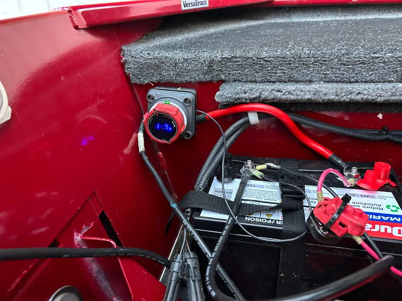 Slide: The Image of 2019 Tracker Pro 160 boat battery compartment with wiring and switch. - 19