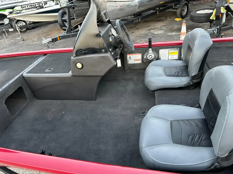 Slide: The Image of 2019 Tracker Pro 160 boat interior with steering console and two seats. - 21