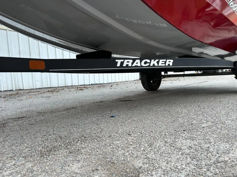 Slide: The Image of 2019 Tracker Pro 160 boat trailer on pavement, side view. - 23
