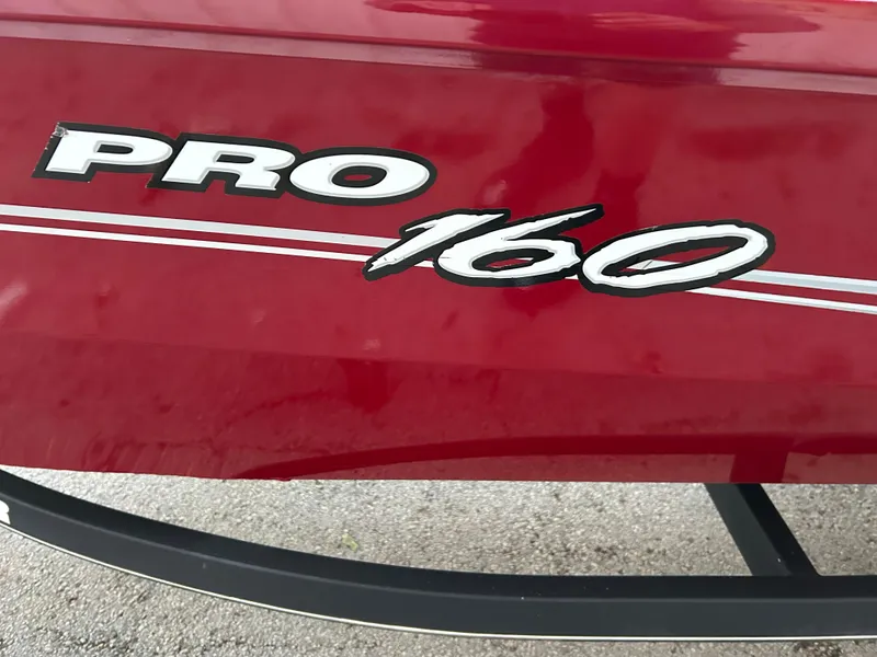 Slide: The Image of Red 2019 Tracker Pro 160 boat with bold white lettering. - 27