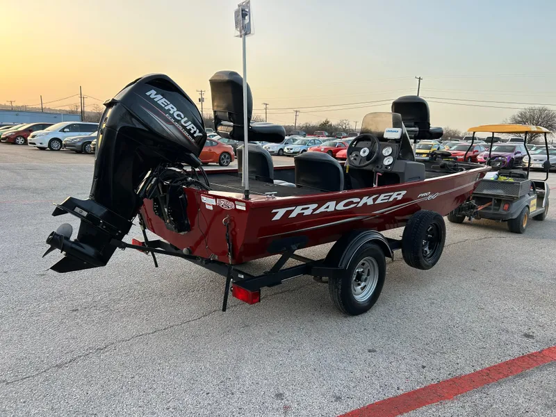 Slide: The Image of 2019 Tracker Pro 160 boat with Mercury engine on trailer in parking lot. - 3
