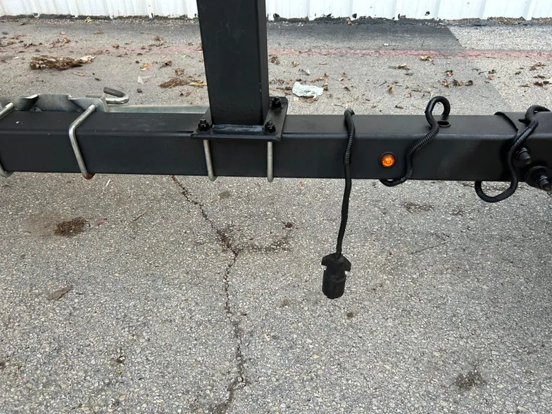 Slide: The Image of Trailer hitch of a 2019 Tracker Pro 160 on asphalt surface. - 36
