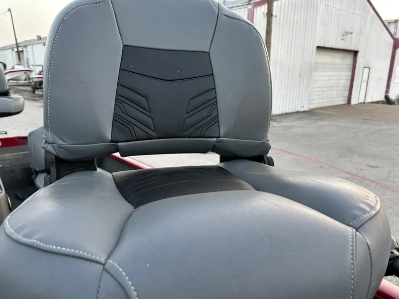 Slide: The Image of 2019 Tracker Pro 160 boat seat with gray upholstery in an outdoor setting. - 38