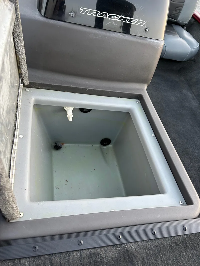 Slide: The Image of 2019 Tracker Pro 160 boat storage compartment, open and empty. - 40