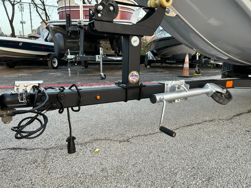 Slide: The Image of Trailer hitch of a 2019 Tracker Pro 160 boat on asphalt. - 43