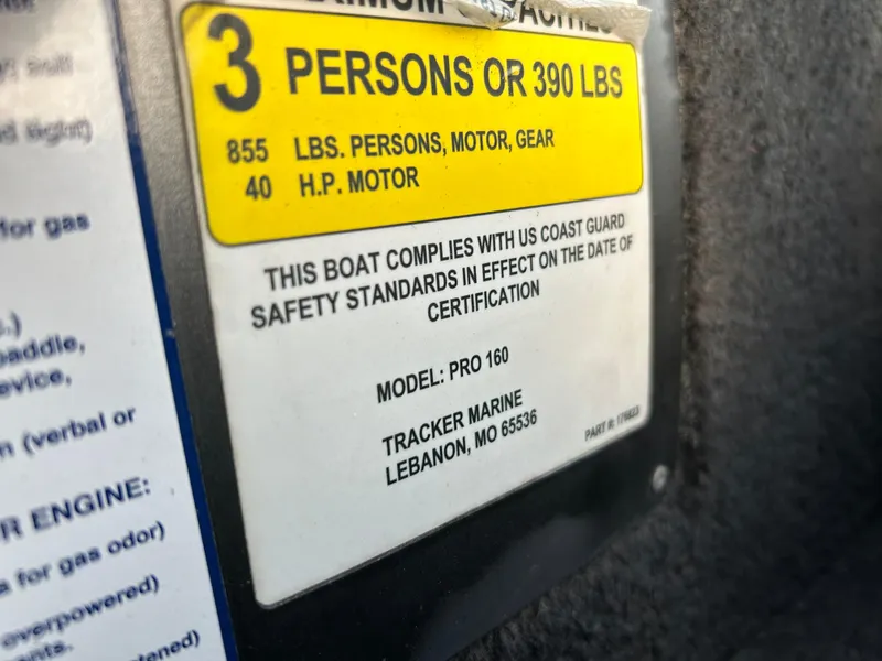 Slide: The Image of Capacity label on 2019 Tracker Pro 160 boat, indicating 3 persons or 390 lbs limit. - 50