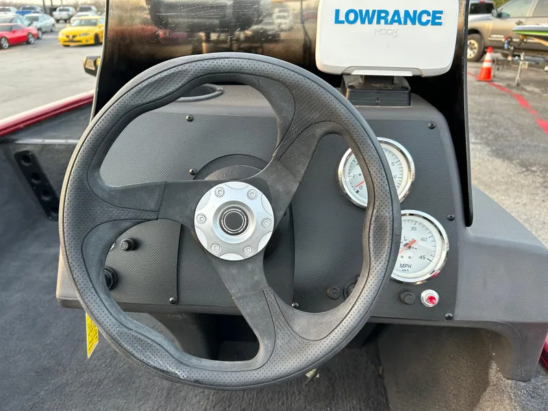 Slide: The Image of Steering wheel and dashboard of a 2019 Tracker Pro 160 boat with Lowrance device. - 51