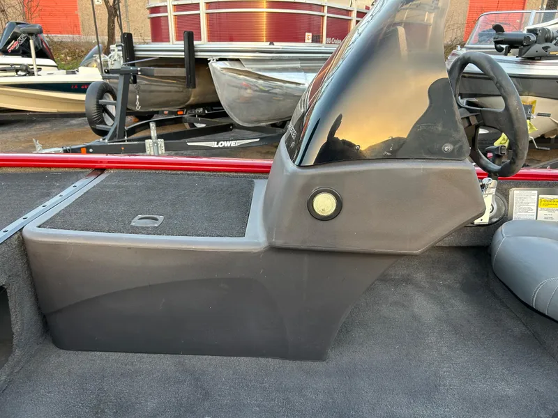 Slide: The Image of 2019 Tracker Pro 160 boat console with steering wheel and windshield. - 54