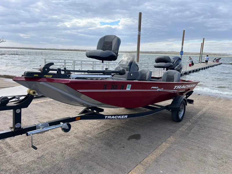 Slide: The Image of 2019 Tracker Pro 160 boat on trailer by lakeside dock. - 6